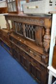 A CARVED OAK COURT CUPBOARD, approximate size width 137cm x height 137cm x depth 45cm