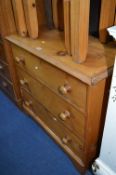 A PINE CHEST, of three long drawers with turned handles and bracket feet