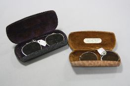 TWO PAIRS OF VINTAGE CLIP ON SUNGLASSES, both pairs cased (2) (situated in the Jewellery Room)