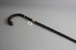 A 9CT COLLARED WALKING STICK