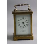 A BRASS CARRIAGE CLOCK, 'H.W Bedford London', approximate height 11cm