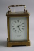 A BRASS CARRIAGE CLOCK, 'H.W Bedford London', approximate height 11cm