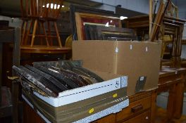 TWO BOXES OF PICTURES, mirrors and frames, five walking sticks and a mantle clock (over 20)
