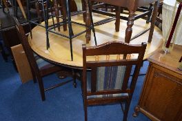 A LARGE CIRCULAR BREAKFAST TABLE, on a triform base, approximate diameter 153cm x height 76cm, eight