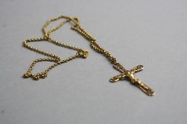 A 9CT CROSS ON A 9CT CHAIN, approximate total weight 5.1grams