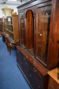 A MAHOGANY PEDESTAL TABLE, one extra leaf, with four chairs and a wall unit (6)