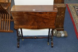 AN EDWARDIAN MAHOGANY SUTHERLAND TABLE, on brass caps and casters