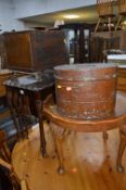A MAHOGANY NEST OF THREE TABLES, occasional table, small oak drop leaf table, metal hat box,