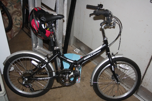 A CHALLENGER FLEX FOLDING BIKE, with two helmets and a pump