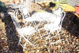 A WHITE PAINTED METAL FOLDING GARDEN TABLE AND FOUR CHAIRS (5)