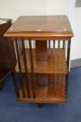A 20TH CENTURY MAHOGANY REVOLVING BOOKCASE, with slatted dividers, approximate size width 56cm x