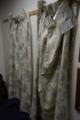 TWO CREAM AND BLUE CURTAINS, with Victorian style scenes, approximate size width 66cm x height