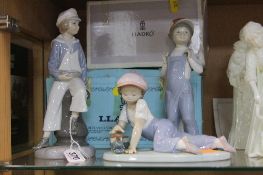 THREE LLADRO FIGURES, to include boxed Sailor Boy with yacht No.4810, 'All Aboard' No.7619 (with a