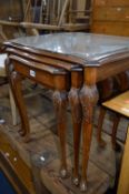 A WALNUT NEST OF THREE TABLES, with single drawer