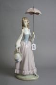 A LLADRO FIGURINE, 'Eloise', lady with parasol and hat, approximate height 42.5cm (some lace work