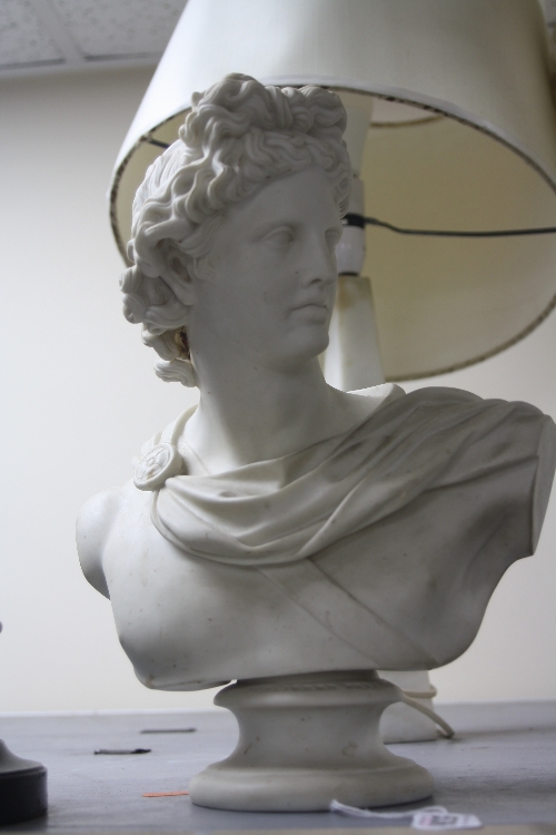 A PARIAN BUST, classical male, signed to the reverse C-Delpech, on waisted socle, impressed '