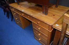 A PINE PEDESTAL DESK, with nine various drawers, approximate size width 140cm x depth 70cm x