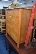 A LIGHT OAK CHEST, of four long drawers