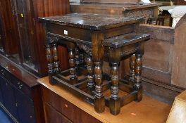 AN OAK NEST OF THREE TABLES, with ring turned legs and carved freize (sd)