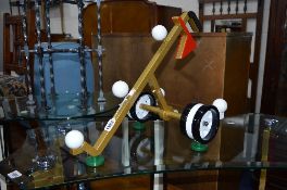 METAL GOLF THEMED TABLE CENTREPIECE, two metal frames and a circular glass occasional table on a