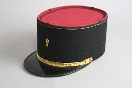 A SECOND HALF 20TH CENTURY FRENCH MILITARY CAP (KEPI), black and red felt, with gilt insigma and