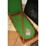 A LATE VICTORIAN MAHOGANY FOLDING BAGATELLE BOARD, with two cues, boxed 'Bonzoline' bagatelle