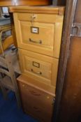 TWO x TWO DOOR FILING CABINETS, one oak finish and one teak finish (both with keys) (2)