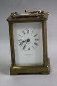 A BRASS CARRIAGE CLOCK, 'E.C. Kemp & Co Paris', approximate height 10.5cm (key)