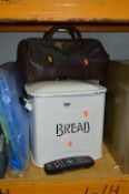 TWO VINTAGE BREAD BINS, and a leather Gladstone bag (3)
