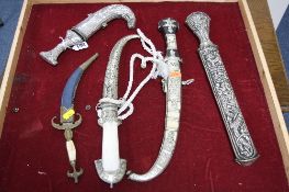 FIVE VARIOUS EASTERN KNIVES, to include Jambiya