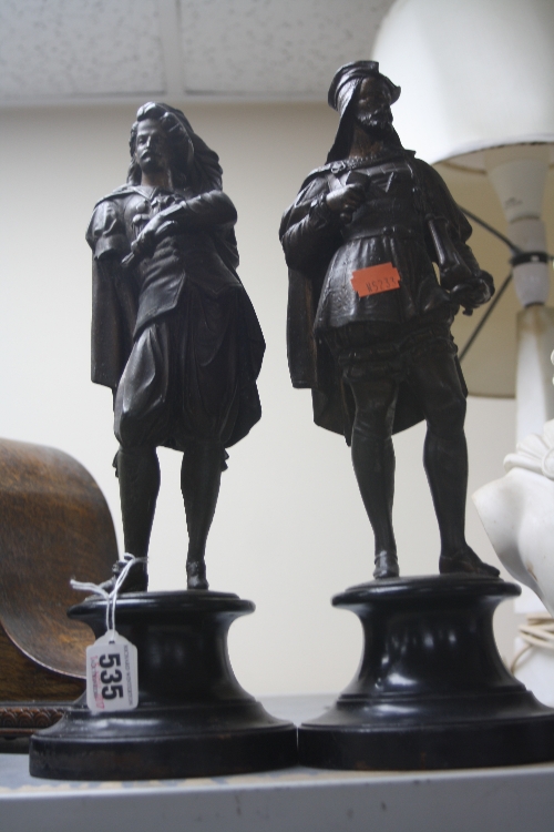 TWO SPELTER GENTLEMEN FIGURES, on wooden plinths, approximate heights 34cm, (one missing arm) (2)