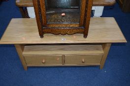 A LIGHT OAK TV STAND, with a single drawer