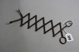 A PAIR OF 19TH CENTURY STEEL LAZY TONGS, of concertina action with six sections, closed length 7.