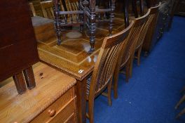 A LARGE HARDWOOD EXTENDING DINING TABLE, with one extra leaf, approximate size length 180cm x