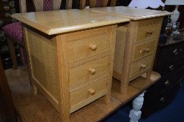 A PAIR OF MARKS AND SPENCER LIGHT OAK THREE DRAWER BEDSIDE CHESTS