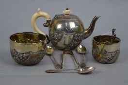 A LATE VICTORIAN SILVER GILT BACHELOR'S TEASET, bullet shaped teapot with ivory fitments, foliate