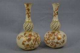 A PAIR OF ROYAL WORCESTER IVORY GROUND ONION SHAPED VASES, shape No.1158, decorated with printed