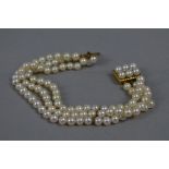 A LATE 20TH CENTURY THREE ROW CULTURED PEARL BRACELET, three rows of Akoya cultured pearl strung