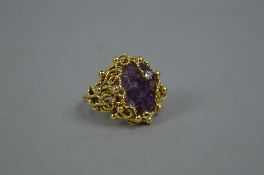 A LATE 20TH CENTURY 18CT GOLD AMETHYST AND DIAMOND RING, by Deakin & Francis, a large abstract