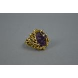 A LATE 20TH CENTURY 18CT GOLD AMETHYST AND DIAMOND RING, by Deakin & Francis, a large abstract