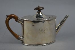 A GEORGE III OVAL SILVER TEAPOT, domed cover with wooden finial and wooden handle, engraved initials