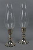 A PAIR OF AMERICAN GORHAM (1980'S) STERLING SILVER CANDLE HOLDERS, with engraved glass shades, on