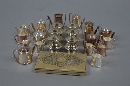 A QUANTITY OF ELIZABETH II MINIATURE SILVER TEAWARES, comprising teapots, coffee pots, twin