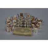 A QUANTITY OF ELIZABETH II MINIATURE SILVER TEAWARES, comprising teapots, coffee pots, twin