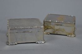 TWO ELIZABETH II RECTANGULAR SILVER TABLE TOP CIGARETTE BOXES, one with engine turned decoration