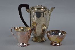 AN ELIZABETH II THREE PIECE SILVER TEASET, circular outline with cast Celtic design rims, comprising