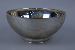 AN ELIZABETH II SILVER CIRCULAR ROSE BOWL, the foot cast with flower head, bead and scroll design,