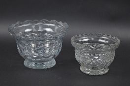 A LATE GEORGIAN CUT GLASS BOWL, wavy rim, cut with circular facets and lozenges, on a star cut foot,