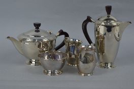 AN ELIZABETH II MATCHED SILVER FIVE PIECE TEASET, comprising teapot, hot water and two milk jugs