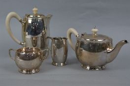 AN ELIZABETH II SILVER FOUR PIECE TEA SET OF CIRCULAR FORM, comprising teapot, hot water jug, milk